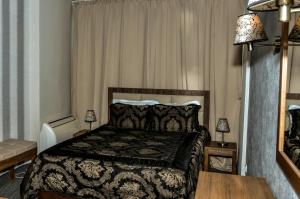 Ένα ή περισσότερα κρεβάτια σε δωμάτιο στο Bononia Hotel