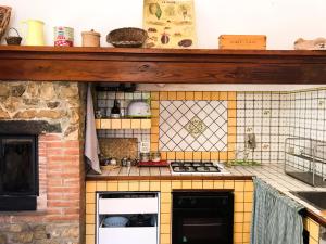 a toy kitchen with a counter top at Agriturismo Testalepre in Greve in Chianti