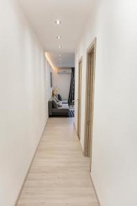 a hallway with white walls and a long hallway with a white hallway at YOUR HOME - Sagrada Familia Apartment in Barcelona