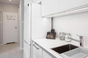 Kuchyňa alebo kuchynka v ubytovaní Apartments City Center by Noclegi Renters