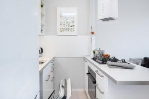 Kuchyňa alebo kuchynka v ubytovaní Apartments City Center by Noclegi Renters