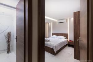 Posteľ alebo postele v izbe v ubytovaní Seashore Stream Suites