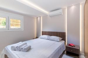 Posteľ alebo postele v izbe v ubytovaní Seashore Stream Suites