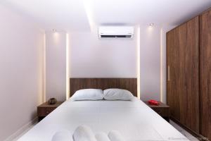Posteľ alebo postele v izbe v ubytovaní Seashore Stream Suites + 19 fotografií