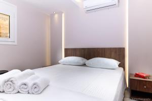 Posteľ alebo postele v izbe v ubytovaní Seashore Stream Suites
