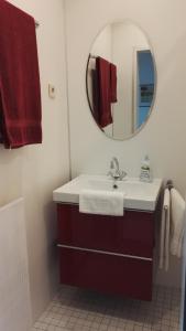 a bathroom with a sink and a mirror at Hotel Römerhof in Saarbrücken