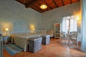 A bed or beds in a room at Antica Locanda La Canonica