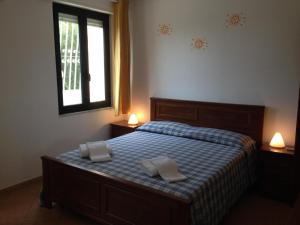 Postel nebo postele na pokoji v ubytování Residence La Giungla