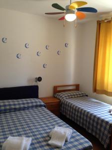 Postel nebo postele na pokoji v ubytování Residence La Giungla