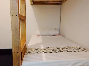 Postel nebo postele na pokoji v ubytování Ijen Backpacker