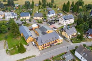 an aerial view of a small town with buildings at Landhotel Quelle in Heidersdorf