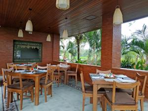 Een restaurant of ander eetgelegenheid bij Paon Desa Ubud