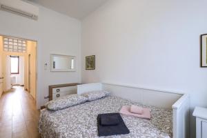 Łóżko lub łóżka w pokoju w obiekcie PrimoPiano - Sammartini