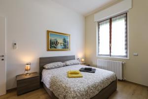 Łóżko lub łóżka w pokoju w obiekcie PrimoPiano - Sammartini