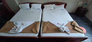 Posteľ alebo postele v izbe v ubytovaní Hotel Prakash