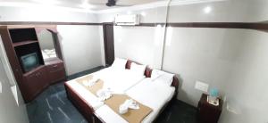 Posteľ alebo postele v izbe v ubytovaní Hotel Prakash