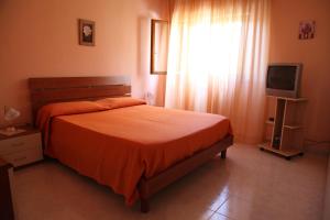 Postel nebo postele na pokoji v ubytování B&B La Villetta