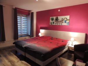 Rúm í herbergi á Hotel de la Gare