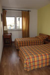 Ένα ή περισσότερα κρεβάτια σε δωμάτιο στο Mafra Guest House