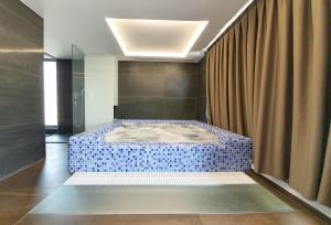Postel nebo postele na pokoji v ubytování NB Hotel&Spa