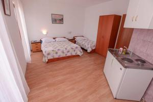 Kuchyň nebo kuchyňský kout v ubytování Apartments Palmero