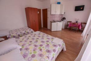 Postel nebo postele na pokoji v ubytování Apartments Palmero