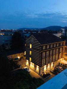a large building with a view of the ocean at Best Western Hotel Strasser in Graz