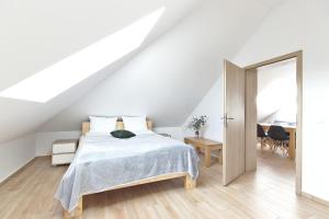 Posteľ alebo postele v izbe v ubytovaní Apartamenty Forma Tatrica