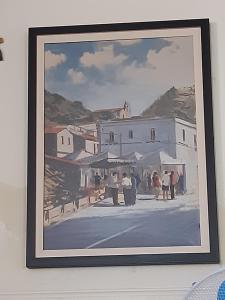 una pintura de una ciudad con gente y edificios en Il Nido Degli Angeli, en Calatabiano