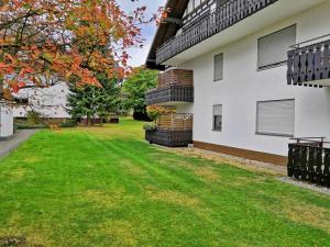 a yard of a house with green grass at Goski & Gobike Winterberg 4K Netflix free in Winterberg