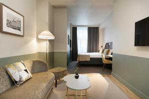 Postel nebo postele na pokoji v ubytování Elite Hotel Savoy