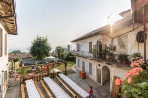 an overhead view of a building with tables and chairs at Ostello del Quadrifoglio in Ameno