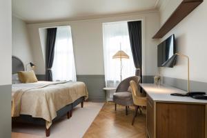 Postel nebo postele na pokoji v ubytování Elite Hotel Savoy