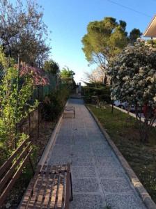 two benches sitting on a path in a park at San Casciano, tra Stifone,le mole e le goledelNera in Narni