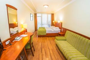 Postel nebo postele na pokoji v ubytování Hotel Silver