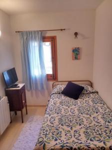 En eller flere senger på et rom på Ca l'Andreu
