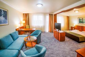Postel nebo postele na pokoji v ubytování Hotel Silver