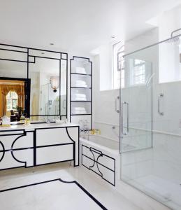 a bathroom with a glass shower and a sink at Milestone Hotel Kensington in London