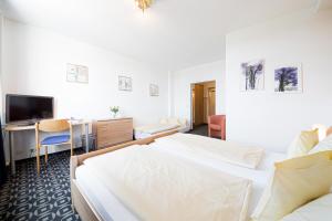 Vuode tai vuoteita majoituspaikassa Europa Hotel Garni