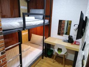 Postel nebo postele na pokoji v ubytování Qing yun resthouse Bandar, Brunei Darussalam