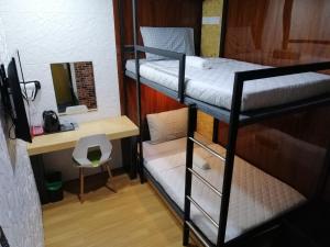Postel nebo postele na pokoji v ubytování Qing yun resthouse Bandar, Brunei Darussalam