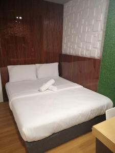 Postel nebo postele na pokoji v ubytování Qing yun resthouse Bandar, Brunei Darussalam