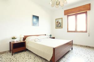 Кровать или кровати в номере App.ti Scala Dei Turchi Tetide