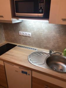Kuchyň nebo kuchyňský kout v ubytování Relax Szófia Apartman