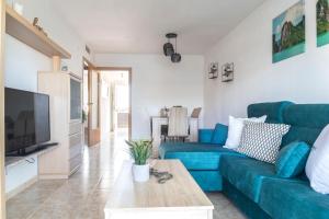 Televízia a/alebo spoločenská miestnosť v ubytovaní Homes&Go Nova Pineda Alto