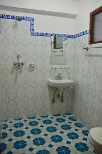 a bathroom with a sink and a toilet at Pokhara Star Inn Pvt Ltd in Pokhara