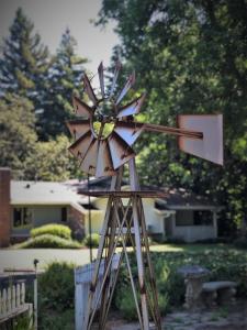a wooden windmill in front of a house at Stahlecker House Inn in Napa