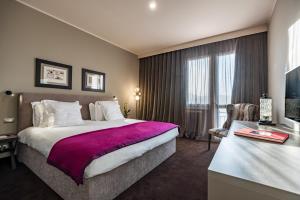 Tempat tidur dalam kamar di Terme di Relilax Boutique Hotel & Spa