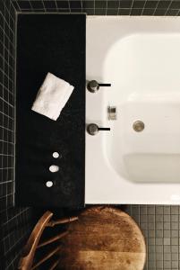 a bathroom with a white sink and a toilet at Mackay's Rooms in Durness