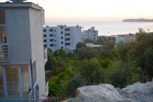 a view of a city with buildings and the ocean at Seaview apartment in Borsh +10 photos